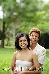 Asia Images Group - Couple embracing, looking at camera