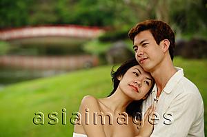 Asia Images Group - Couple embracing, woman leaning on mans chest