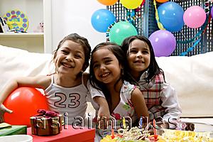 Asia Images Group - Children at a birthday party, looking at camera, smiling