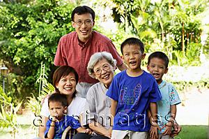 Asia Images Group - Three generation family, smiling at camera