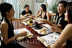 Asia Images Group - Adults having dinner party