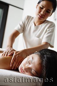 Asia Images Group - Woman being massaged by masseuse