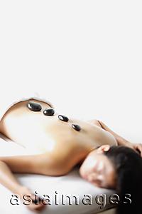 Asia Images Group - Woman having stone massage