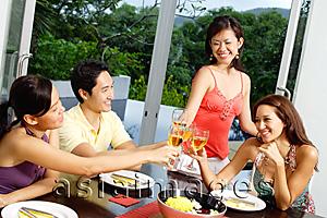 Asia Images Group - Young adults toasting with wine glasses