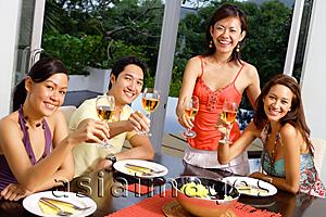 Asia Images Group - Young adults raising wine glasses, towards camera