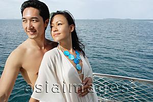 Asia Images Group - Couple standing on yacht