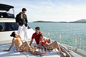 Asia Images Group - Young adults on boat deck