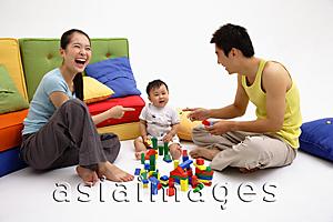 Asia Images Group - Family with one child, sitting on floor, playing with toys