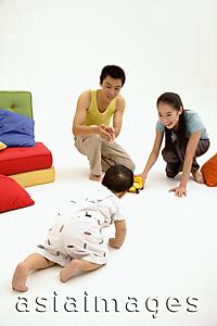 Asia Images Group - Baby by crawling towards his parents