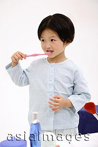 Asia Images Group - Young girl brushing her teeth