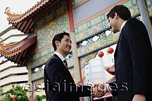 Asia Images Group - Two businessmen shaking hands