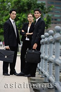 Asia Images Group - Business people standing, looking at camera