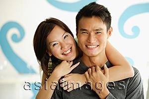Asia Images Group - Woman with arm around man, both smiling at camera