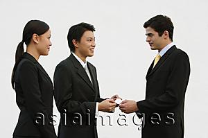 Asia Images Group - Business people exchanging name cards