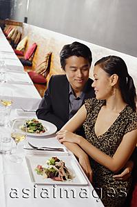 Asia Images Group - Couple sitting side by side in restaurant