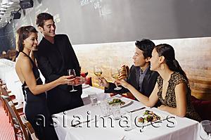 Asia Images Group - Couples in restaurant, toasting with wine glasses