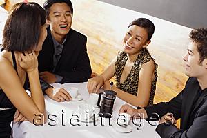 Asia Images Group - Couples sitting in restaurant, having coffee
