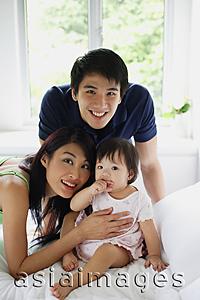 Asia Images Group - Family with one child, looking at camera