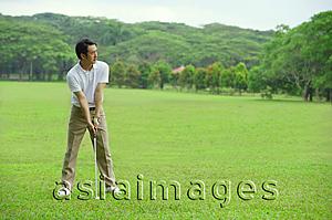 Asia Images Group - Mature man playing golf