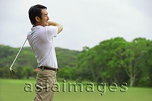 Asia Images Group - Man playing golf