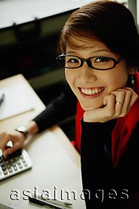 Asia Images Group - Woman with dark glasses, smiling at camera