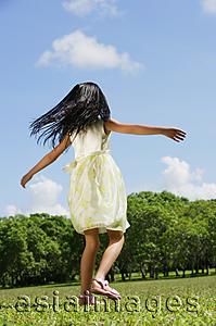 Asia Images Group - Girl running in park, rear view