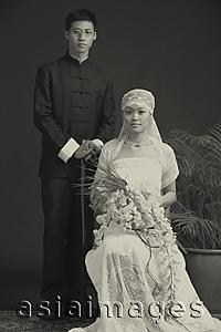 Asia Images Group - Old fashioned studio portrait of bride and groom