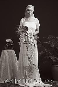 Asia Images Group - Woman in wedding gown, looking at camera, portrait