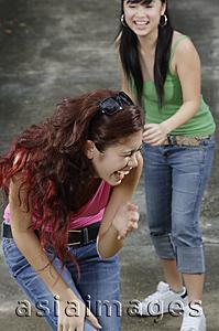 Asia Images Group - Two teenage girls laughing