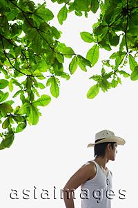 Asia Images Group - Man wearing hat, looking away