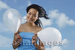 Asia Images Group - Woman holding two  white balloons