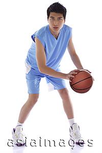 Asia Images Group - Young man with basketball