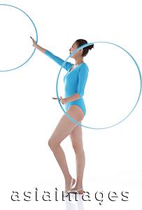 Asia Images Group - Rhythmic gymnast holding hoop