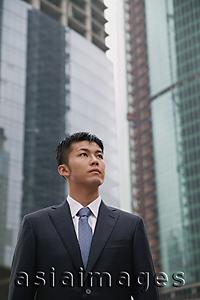 Asia Images Group - Businessman in the city, looking away