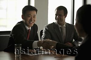 Asia Images Group - Business people shaking hands during a meeting