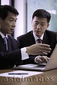Asia Images Group - Businessmen talking over computer