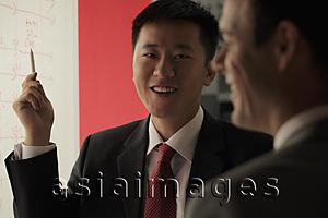 Asia Images Group - Businessmen laughing during a meeting