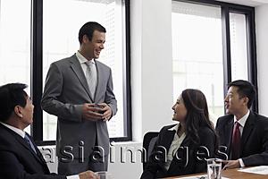 Asia Images Group - Young man talking during a business meeting