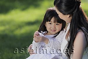 Asia Images Group - Mother holding daughter outdoors