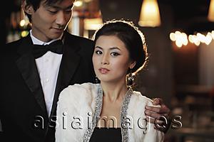 Asia Images Group - Young couple elegantly dressed at night