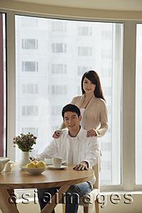 Asia Images Group - Young couple together in their condo