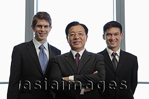 Asia Images Group - Three businessmen standing together
