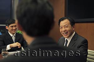 Asia Images Group - Businessmen laughing during a business meeting