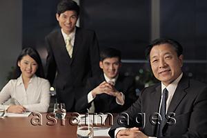 Asia Images Group - Four people having a business meeting