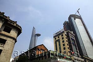 Asia Images Group - Old and new buildings with Bitexco Financial Tower in background. Ho Chi Minh, Vietnam