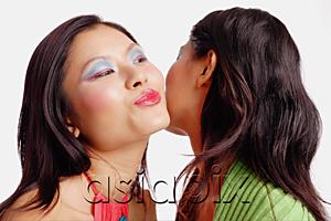 AsiaPix - Woman with mouth puckered, kissing other woman