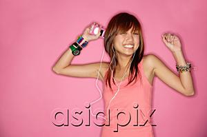 AsiaPix - Young woman smiling, using headphones