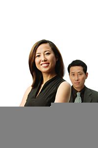 AsiaPix - Woman with arms crossed, smiling at camera, man standing behind her