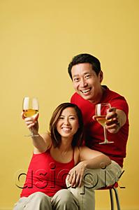 AsiaPix - Couple holding drinks up for a toast