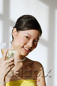 AsiaPix - Woman holding wine glass, smiling at camera